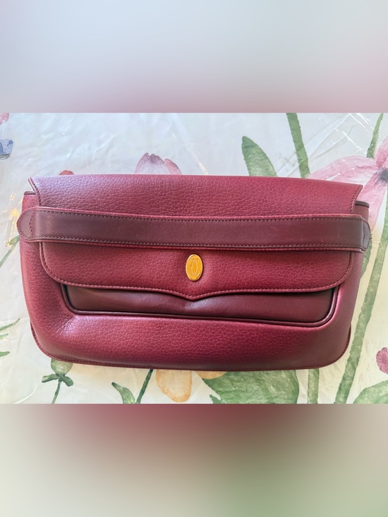 Cartier Handbags - Cartier Maroon Leather Clutch with Gold Logo Oval